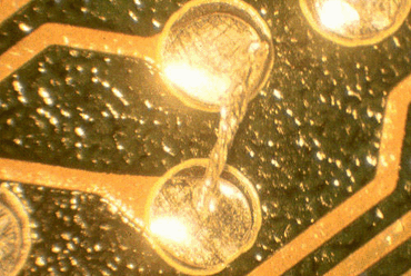 Figure 3: Another solderball attached to the edge of a resist Figure 3: Another solderball attached to the edge of a resist